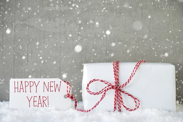 Prezent, Cement tło z płatki śniegu, tekst szczęśliwego nowego roku — Zdjęcie stockowe