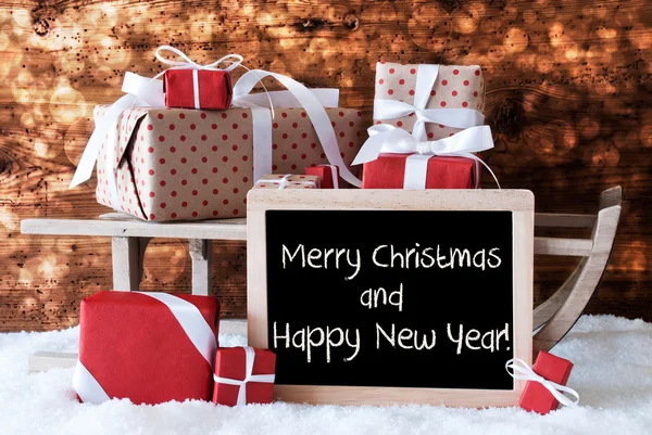 Slee met geschenken, sneeuw, Bokeh, tekst vrolijk kerstfeest, Nieuwjaar — Stockfoto