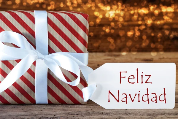 Atmosfäriska gåva med etikett, Feliz Navidad betyder god jul — Stockfoto