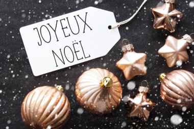 Bronz toplar, kar taneleri, Joyeux Noel mutlu Noeller anlamına gelir.