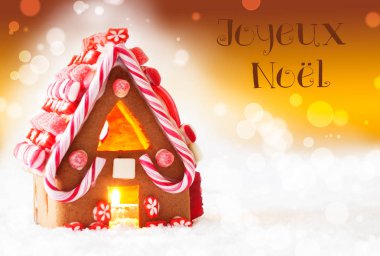 Gingerbread House, altın arka plan, Joyeux Noel mutlu Noeller anlamına gelir.