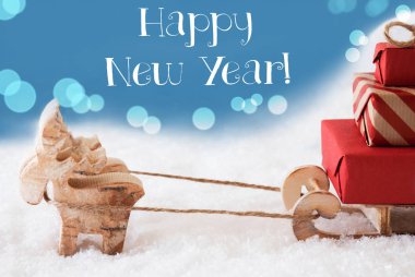 Ren geyiği, kızak, mavi arka plan, metin mutlu yeni yıl ışık