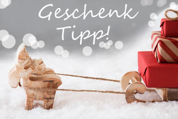 Rendier met slede, zilveren achtergrond, Geschenk Tipp betekent cadeau Tip — Stockfoto