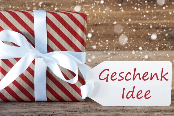 Présenter avec des flocons de neige, Texte Geschenk Idee signifie idée cadeau — Photo