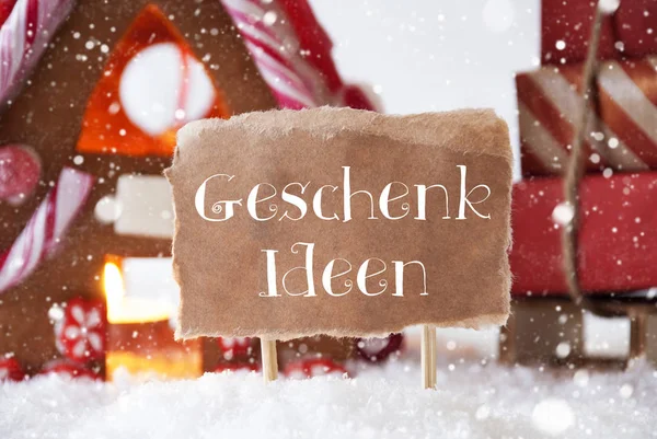 Peperkoek huis met slee, sneeuw, Geschenk Ideen betekent cadeau-ideeën — Stockfoto