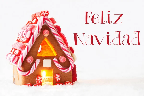Lebkuchenhaus, weißer Hintergrund, feliz navidad bedeutet frohe Weihnachten — Stockfoto