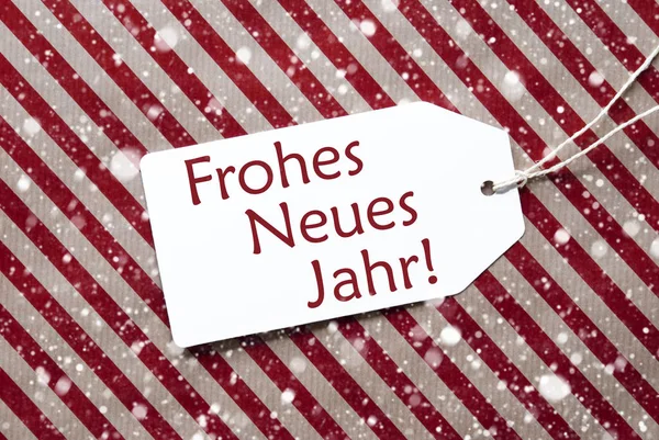 Címke a piros papírt, Neues Jahr eszközök új év, hópelyhek — Stock Fotó