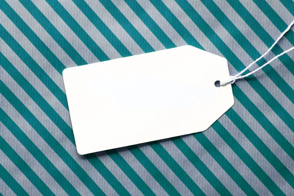 Label On Turquoise Wrapping Paper And Copy Space — Stock Photo, Image