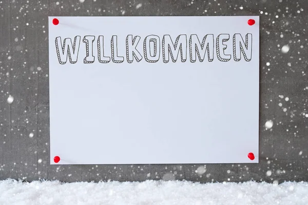 Etiket çimento duvar, kar taneleri, Willkommen anlamına gelir hoş geldiniz — Stok fotoğraf