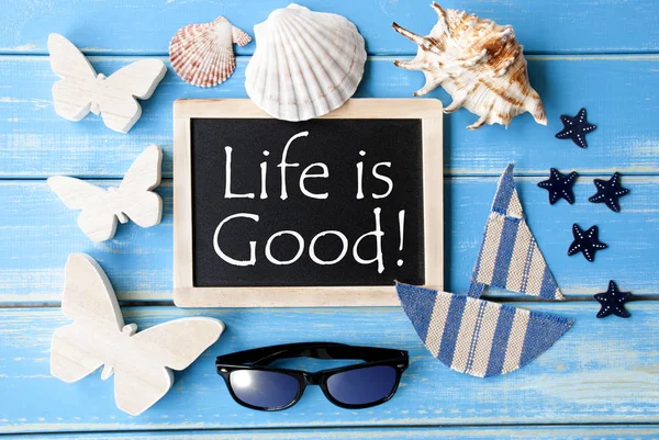 Lavagna con decorazione marittima e citazione La vita è buona — Foto Stock