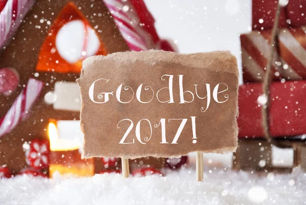 Пряниковий будинок з розсадою, сніжинками, текстове прощання 2017 — стокове фото