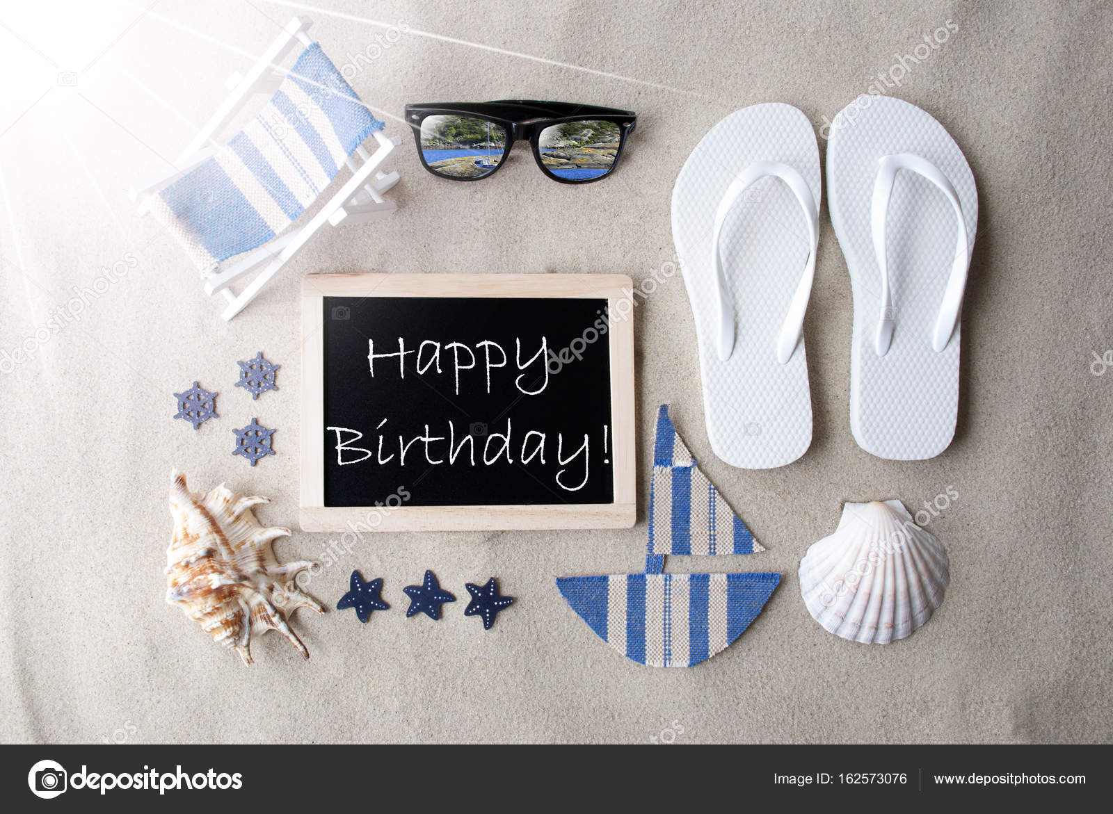 Sunny Blackboard On Sand With Text Happy Birthday Stock Photo