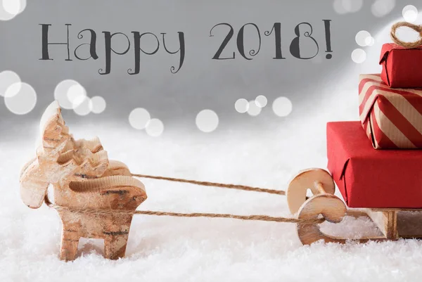 Rentier mit Schlitten, silberner Hintergrund, Text happy 2018 — Stockfoto