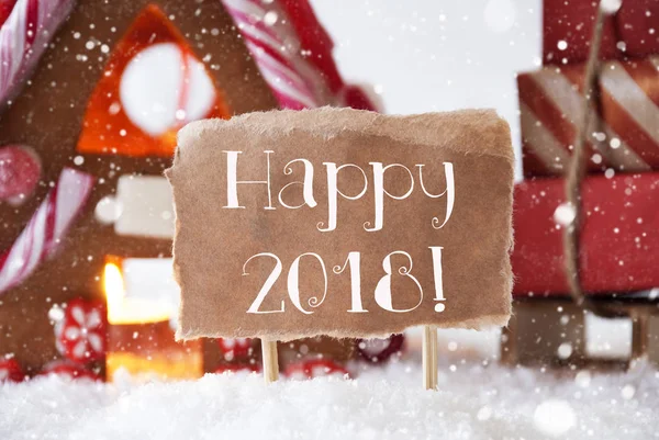 Μελόψωμο σπίτι με έλκηθρο, νιφάδες χιονιού, κείμενο ευτυχισμένη 2018 — Φωτογραφία Αρχείου