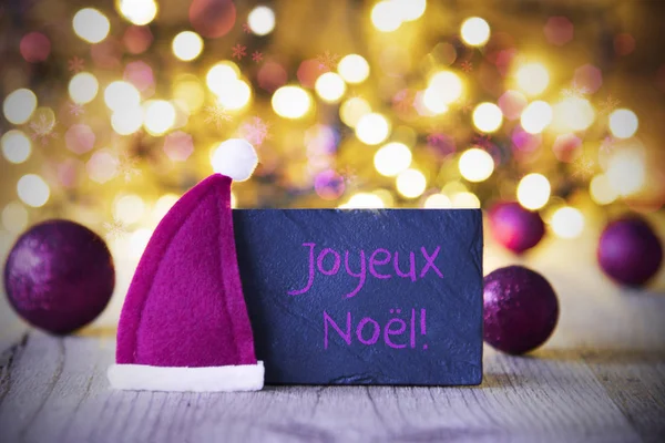 Plaat, kerstmuts, lichten, Joyeux Noel betekent vrolijk kerstfeest — Stockfoto