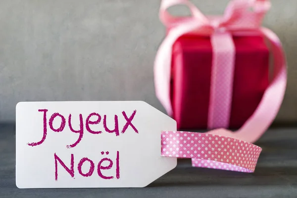 Presente rosa, Etiqueta, Joyeux Noel significa Feliz Natal — Fotografia de Stock