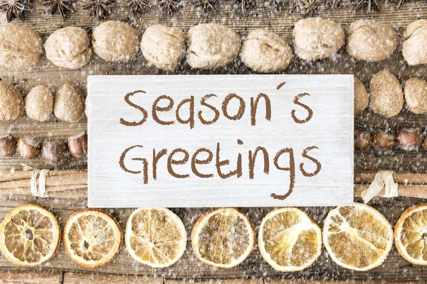 Julmat platt lekmanna, Text Seasons Greetings, snöflingor — Stockfoto