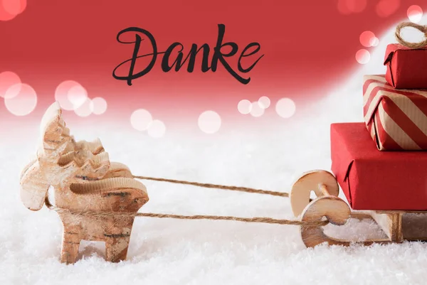 Reindeer, Sled, Snow, Red Background, Danke Means Thank You — стокове фото