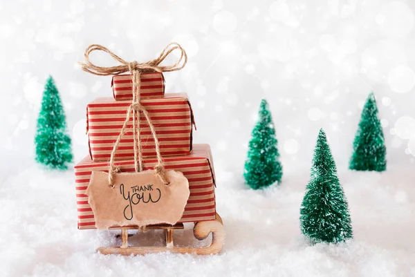 Sled, Aanwezig, Sneeuw, Dank u, Grijze achtergrond — Stockfoto