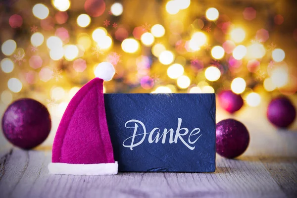 Jiskřivá světla, koule, fialová čepice Santa, Danke znamená Děkuji — Stock fotografie