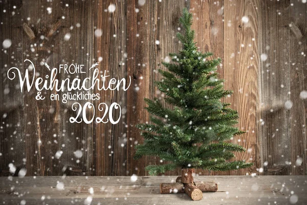 树，书法Frohe Weihnachten意思是圣诞快乐，雪 — 图库照片