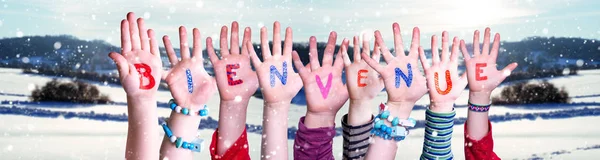 Children Hands Building Word Bienvenue Means Welcome, Snowy Winter Background —  Fotos de Stock