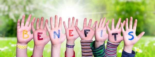 Children Hands Building Word Benefits, Grass Meadow — Stockfoto