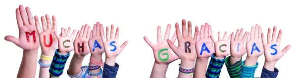 孩子们手拉手造词Muchas Gracias意为"谢谢你，孤立的背景" — 图库照片