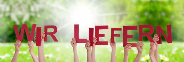 People Hands Holding Word Wir Liefern Means Delivery Service, Grass Meadow — Stock Photo, Image