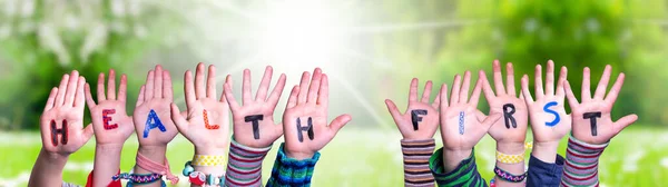 Children Hands Building Word Health First, Grass Meadow — Stock Photo, Image