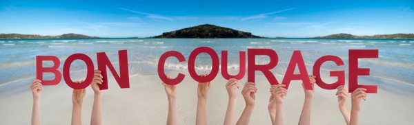 People Hands Holding Word Bon Courage Means You Can Do It, Ocean Background — Stock Photo, Image