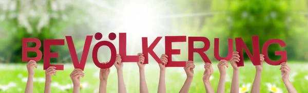 People Hands Holding Word Bevoelkerung Means Population, Grass Meadow — Stock Photo, Image