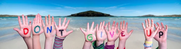 Children Hands Building Word Do Not Give Up, Ocean Background — Stock Photo, Image