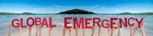 People Hands Holding Word Global Emergency, Ocean Background — Stock Photo, Image