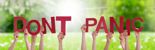 People Hands Holding Word Dont Panic, Grass Meadow — Stock Photo, Image