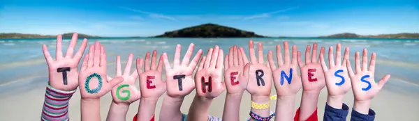 Kinderhände Word Togetherness, Ocean Background — Stockfoto