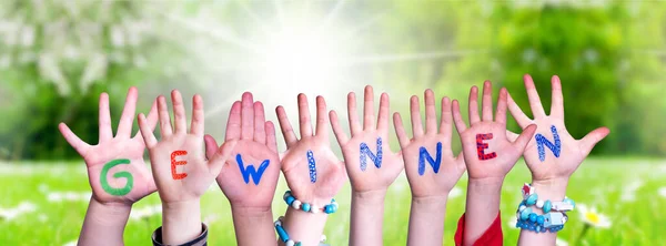 Children Hands Building Word Gewinnen Means Win, Grass Meadow — Stock Photo, Image