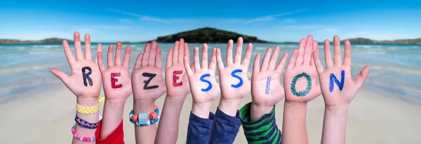 Children Hands Building Word Rezession Means Recession, Ocean Background — Stock Photo, Image