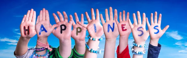 Barn händer bygga ord lycka, blå himmel — Stockfoto