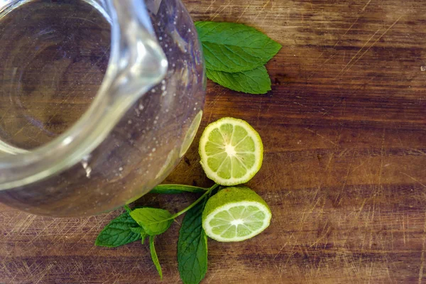 Fresh Lemons Limes Mint Leaves Glass Jar Soda Water Wooden — Stock Photo, Image