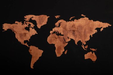 World map of earth showing continents on a wood tree ring textured background