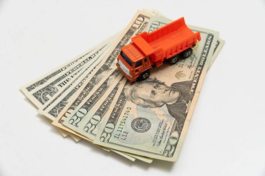 a toy truck is on the banknotes