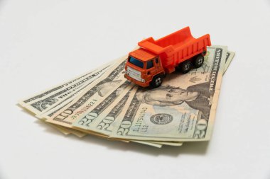 a toy truck is on the banknotes