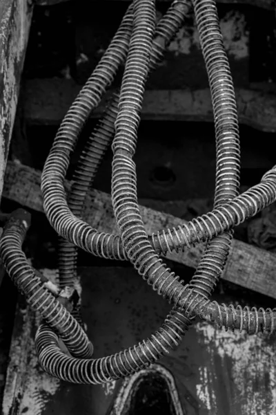 Dirty hydraulic hoses of old backhoe