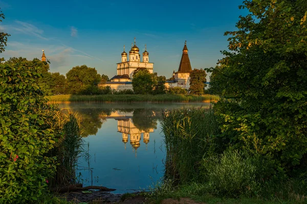 Mirror surface of the lake of Joseph-Volotsky Monastery. Beautiful lake near the Joseph-Volotsky Monastery. The cloister is located in the village of Teryaevo, Volokolamsk municipal district of the Moscow region.