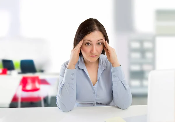 Overworked business woman Stock Photo
