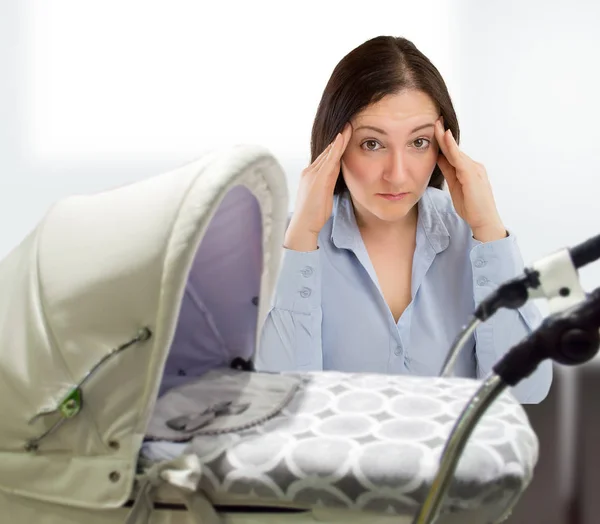 Harried mother with baby — Stock Photo, Image