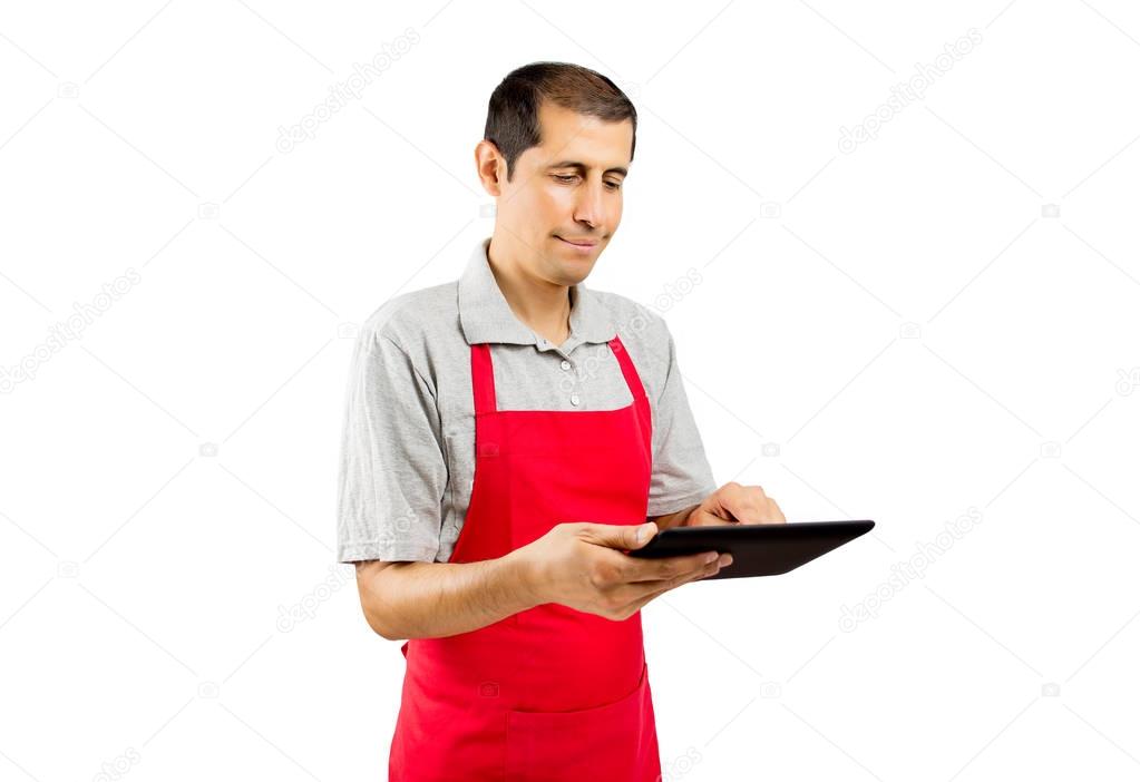assistant with apron using digital tablet