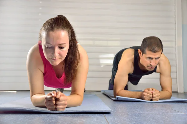 young people exercising at the gym