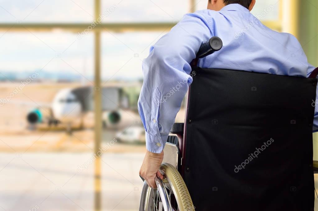 wheelchair businessman at airport
